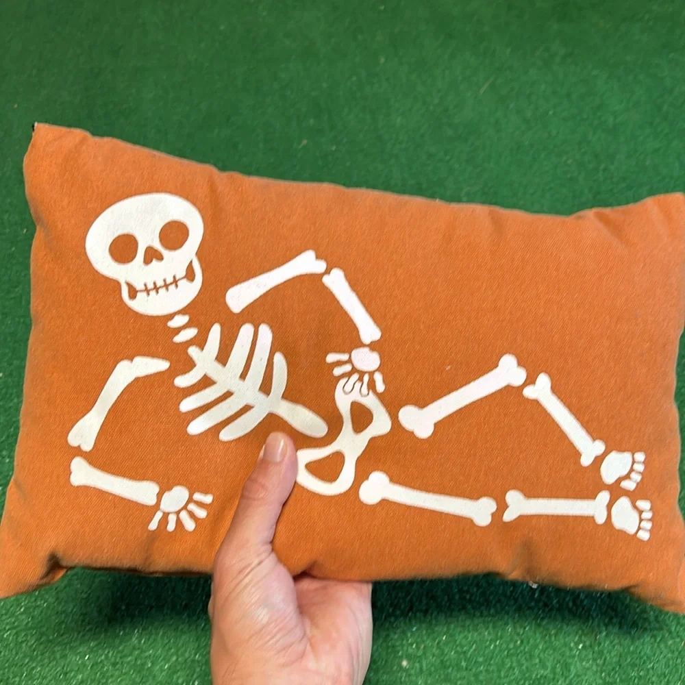 Orange Skeleton pillow! (Some strings showing in corners and lower front)